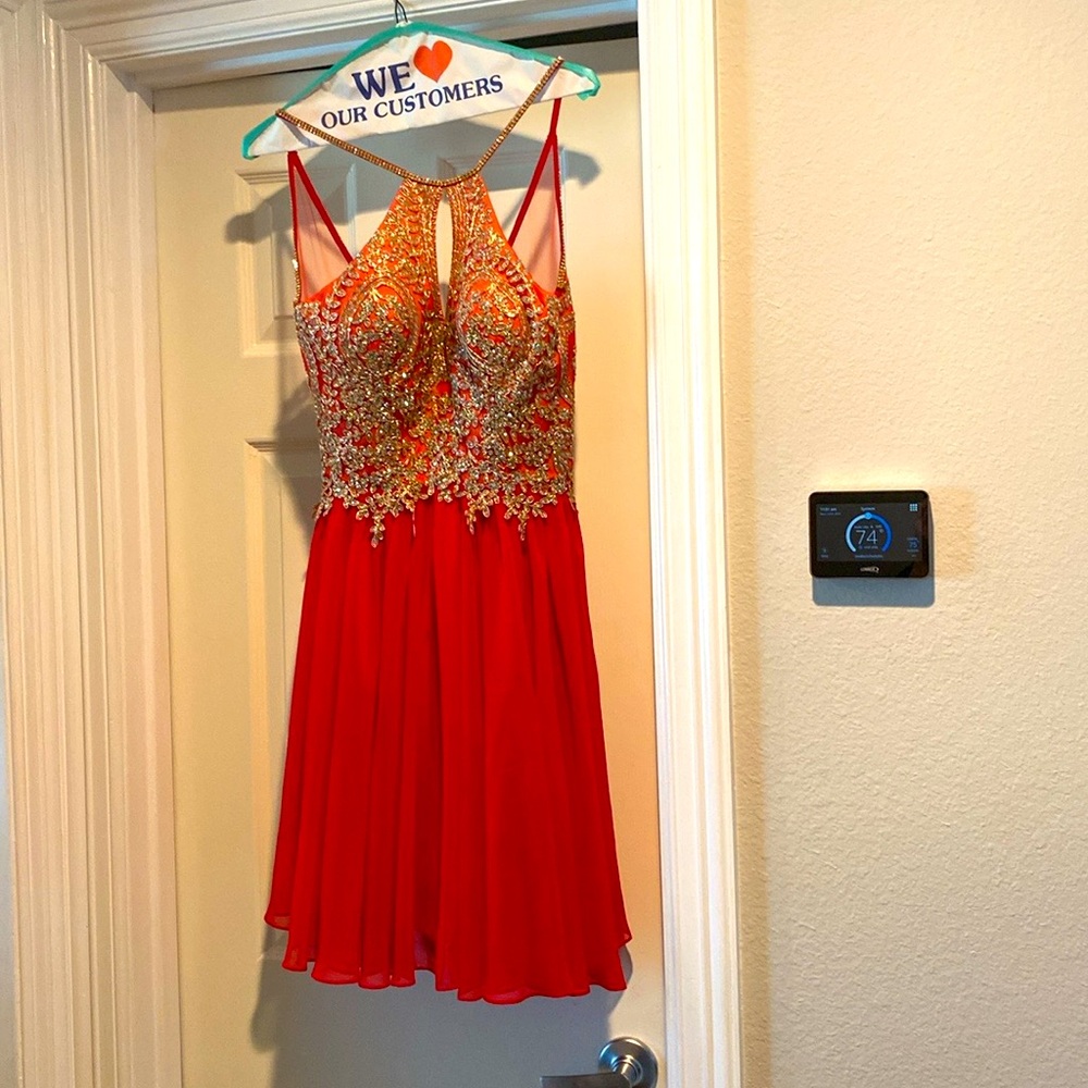Short gold, rhinestone and red dress size 5/6 worn once and dry cleaned.
